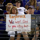 Photo updated Oct. 1, 2017: A fan sits behind a sign referring to former San Francisco 49ers quarterback Colin Kaepernick in the second half of the Washington team versus Baltimore Ravens preseason game at M&T Bank Stadium on Aug. 10, 2017, in Baltimore. (Rob Carr/Getty Images)